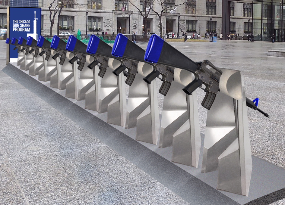 The Gun Share installation instead holds a row of ten replica AR-15 rifles