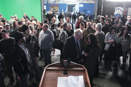 Attendees await the start of the press conference