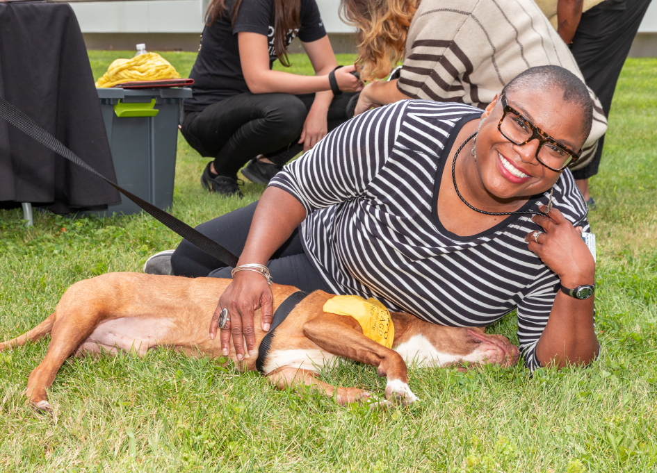 CineCares Foundation Executive Director Sheila Brown makes a friend at Cinespace (photo by Stephen Lotho courtesy of PAWS)