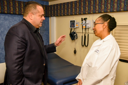 Presdient and CEO of Cinespace Chicago Film Studios Alex Pissios tours the inside of the Unit with Icy Cade-Bell, MD, Medical Director of the Pediatric Mobile Medical Unit.