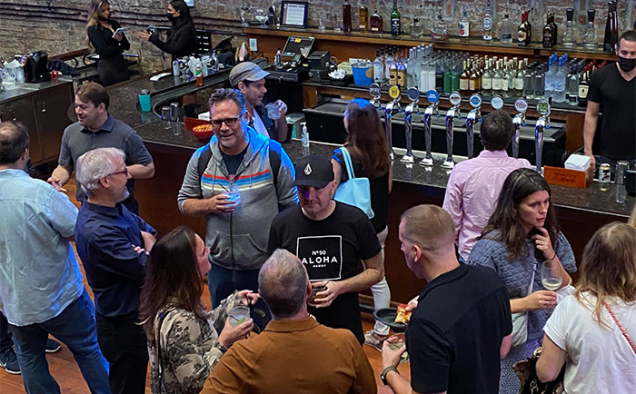 Friends and colleagues gather for AICP/Midwest  Meet. Drink. Talk. event